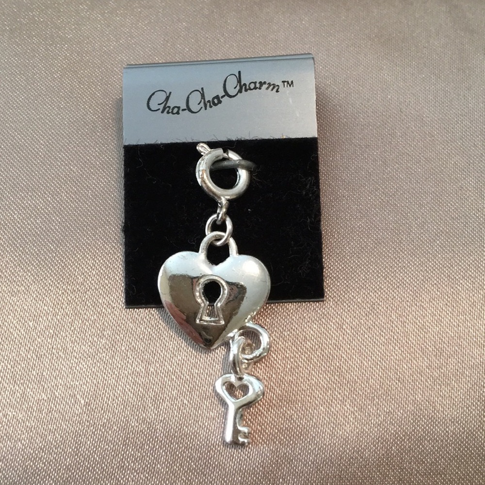 Selling a NEW Cha Cha Charm...heart ❤️ with key